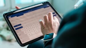 Tradesperson using the Checker app on a tablet