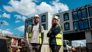 Two trades professionals on a UK construction site